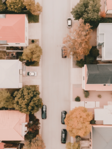 A neighborhood where each house is a different size puzzle piece fitting together perfectly