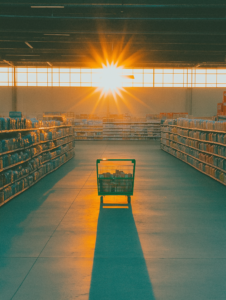 A spotlight shining on a single discounted product in an otherwise dark store