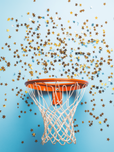 A basketball hoop surrounded by a swirl of stars, representing the feeling of accomplishment when scoring a point