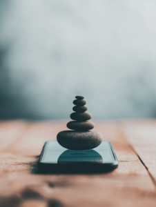 A close-up of a phone screen with a mindfulness or meditation app open, showcasing the role of digital tools in managing stress