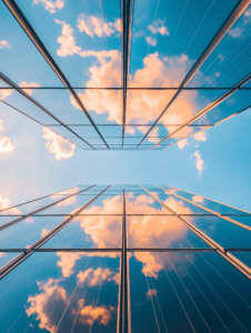 A close-up of solar panels reflecting the sky, symbolizing the intersection of technology and nature