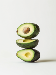 A dumbbell made of stacked avocados, symbolizing healthy fats fueling strength and endurance