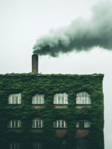 A factory emitting smoke, but with green vines growing on the building, symbolizing the balance or conflict between industry and environmental sustainability