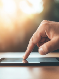 A finger pressing a digital ballot on a tablet or touchscreen, representing the rise of technology in modern elections