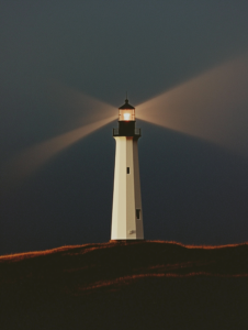 A lighthouse with two beams of light crossing, guiding one another through the dark, representing mutual guidance and support