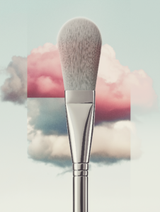 A makeup brush painting the sky with vibrant hues, representing beauty as an art that transforms the world around us