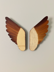 A pair of wings lifting off together, symbolizing how close bonds allow people to soar higher together