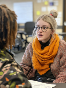 A peer mentoring session where individuals with disabilities share experiences and support one another, emphasizing community empowerment