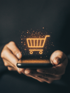 A person shopping online using their smartphone, with a digital shopping cart icon floating above, showcasing the rise of e-commerce