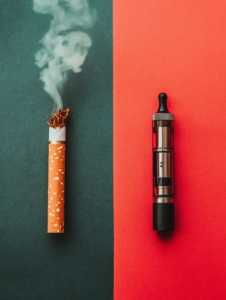 A side-by-side comparison of traditional cigarettes and vaping devices, highlighting the ongoing battle with nicotine addiction