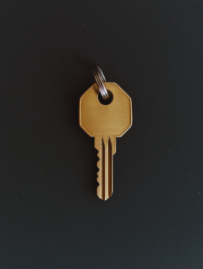 A single lock with two keys, representing the shared trust and mutual openness between people with close bonds