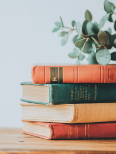 A stack of self-help books about addiction and recovery, emphasizing the importance of education in healing