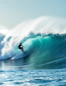 A surfer riding a wave, showcasing the harmony between humans and the power of the ocean